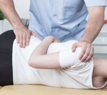 Chiropractic examining patient